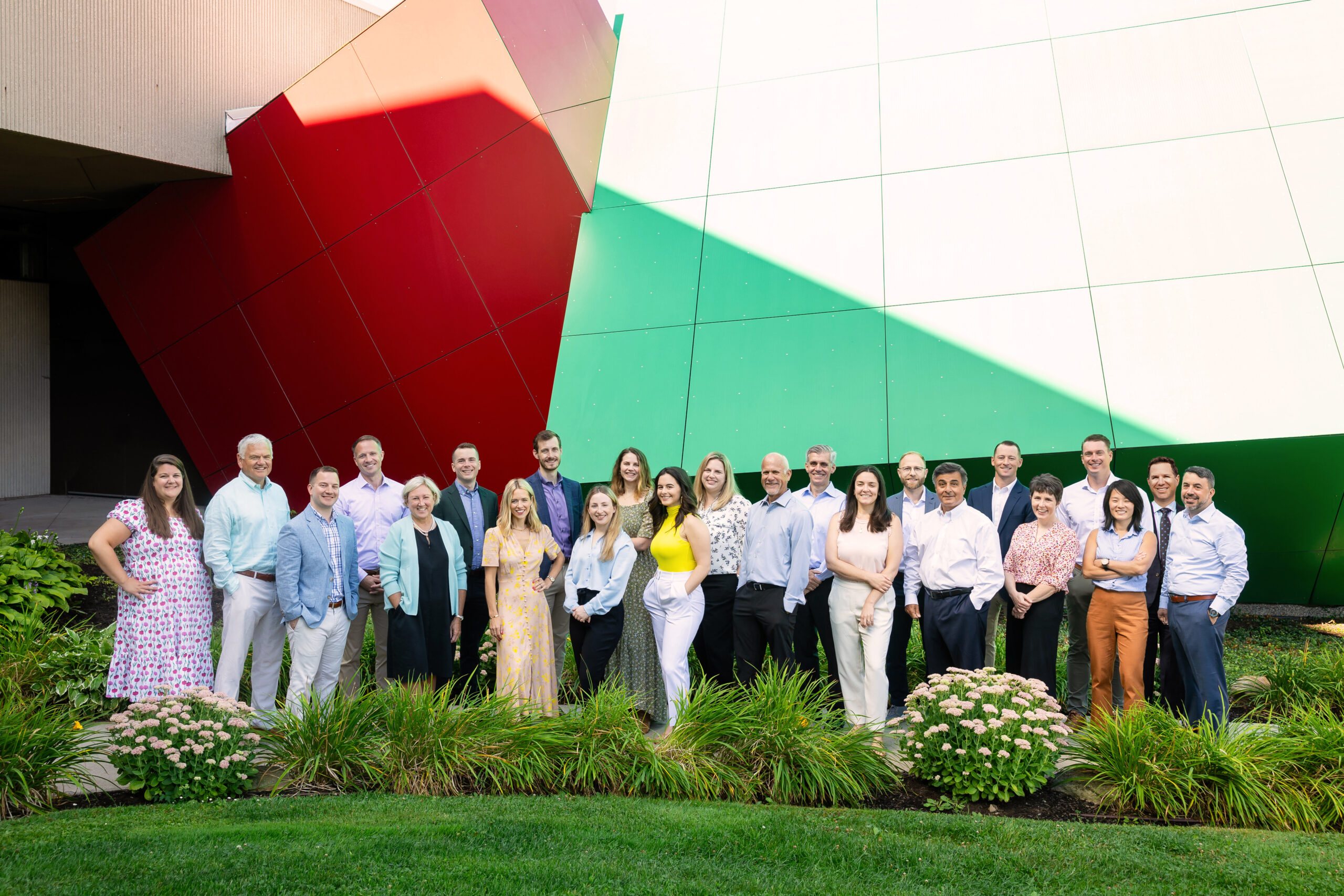 the Howe & Rusling team standing in front of the Strong Museum of Play on a sunny summer day