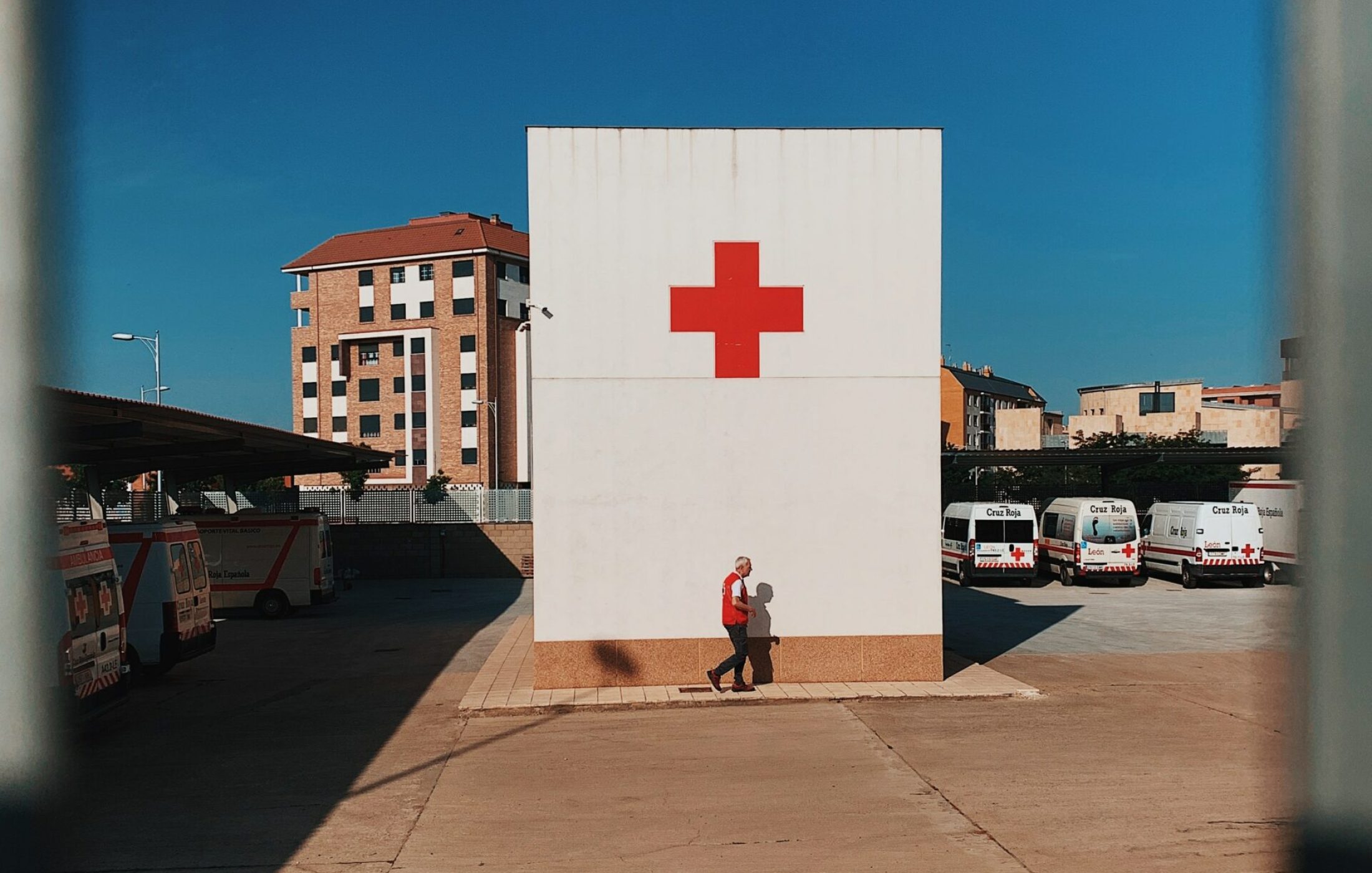 White building with red aid sign